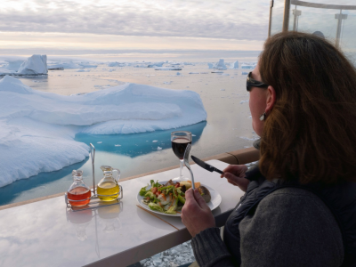 Passenger-enjoying-meal-onboard-the-Greg-Mortimer-Antarctica-Scott-Portelli.png